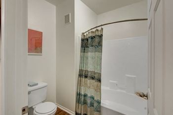 Large soaking tub in master bathroom with a tile surround